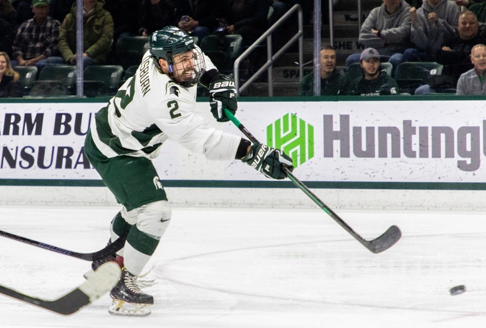 Senoir defenseman Zach Osburn (2) takes a shot during the game against Penn State on Feb.16, 2019. The Spartans fell to the Nittany Lions 5-3.