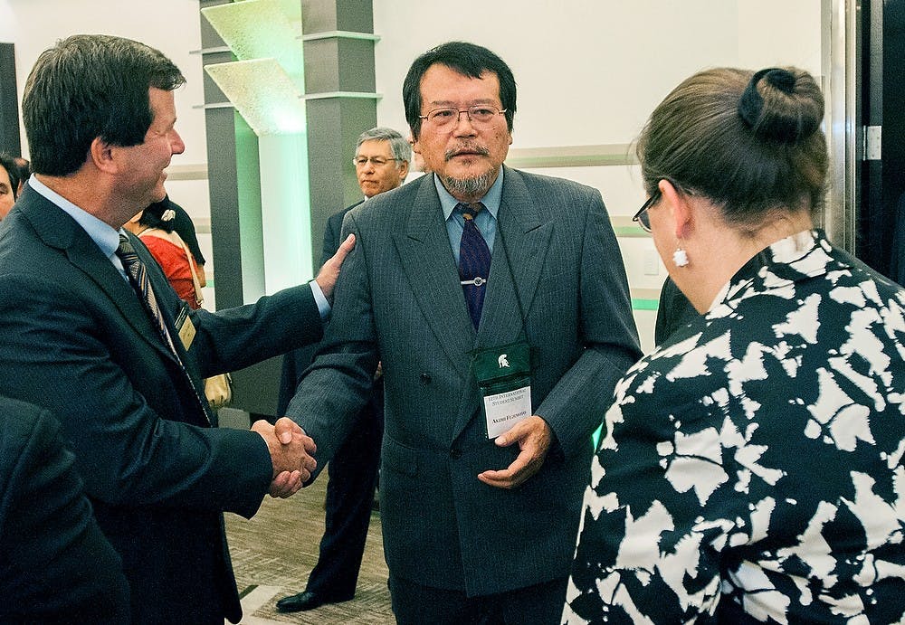 	<p>From left, Jeffrey Riedinger the dean of international studies and programs, Dr.Akimi Fujimoto a professor at the Tokyo University of Agriculture, and Jamie Clover Adams the director of the Michigan Department of Agriculture and Rural Development introduce themselves on Wednesday, Oct. 3, 2012 at the Kellogg Center. Michigan State hosted the International Student Summit on Food, Agriculture and the Environment which brought together representatives from over 17 countries. James Ristau/The State News</p>