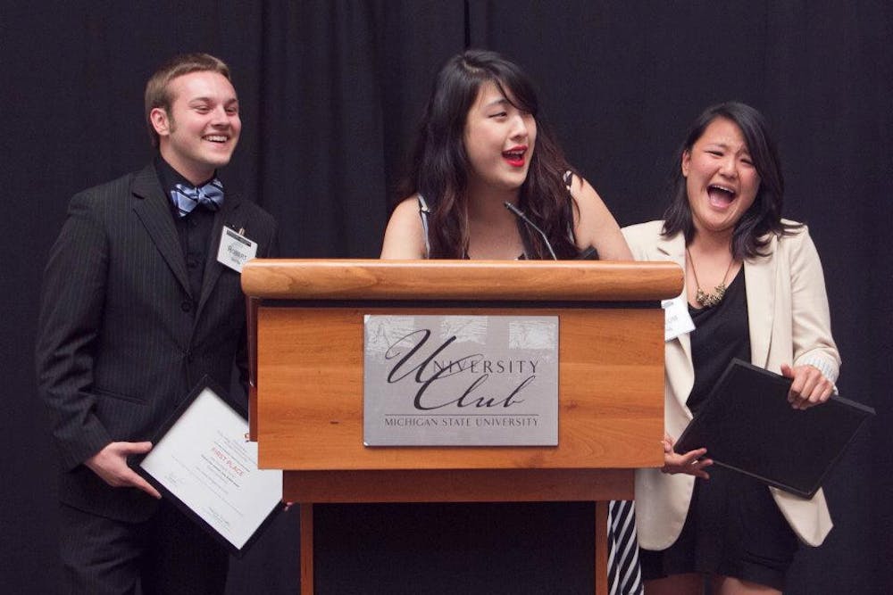 Team "One Branch Too Far", comprised of advertising majors, senior Robert Smith, left, junior Victoria Zou, middle, and senior Ahreum Jung accept their $5,000 reward for winning the 2012 Media Sandbox Creative Challenge. The challenge was for teams to create a campaign that would promote MSU's new Media Sandbox. 