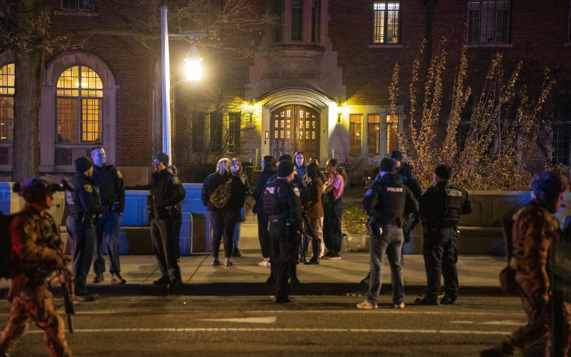 <p>Students stand outside Campbell Hall surrounded by police after being released from the shelter-in-place during the mass shooting on Monday, Feb. 13, 2023, located at Michigan State University’s North Neighborhood.</p>