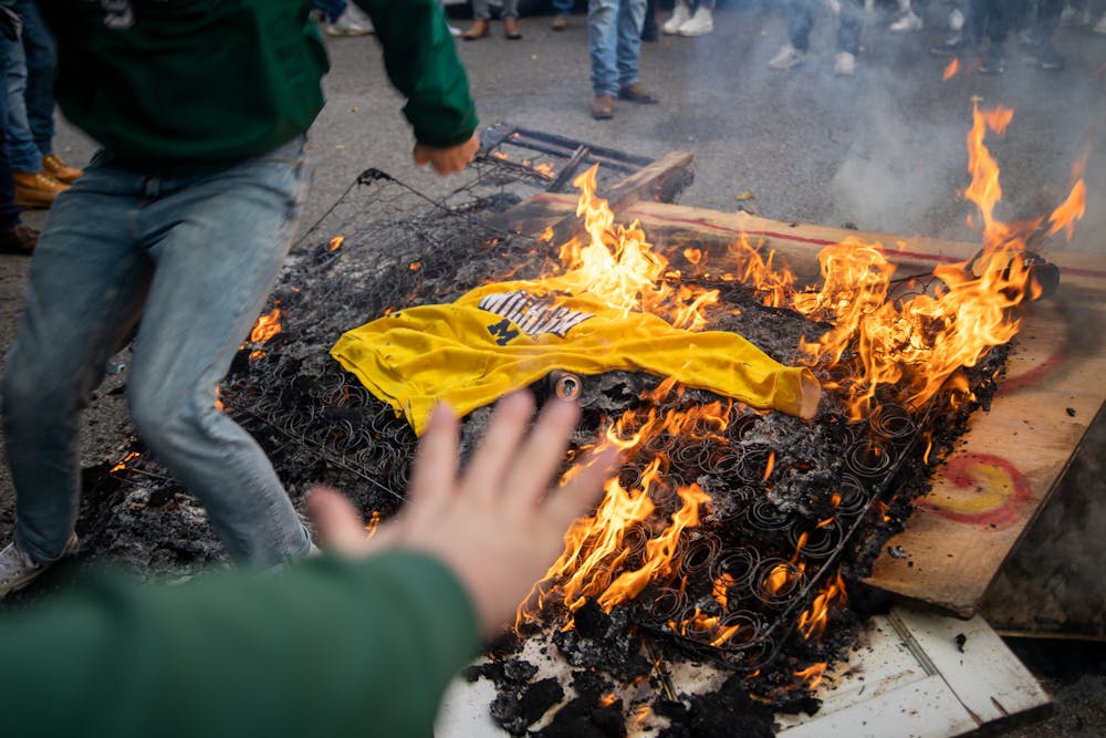 <p>Fire topped off with a &#x27;Michigan&#x27; sweatshirt in East Lansing, MI after Michigan State football beat Michigan football on Oct. 30, 2021. </p>