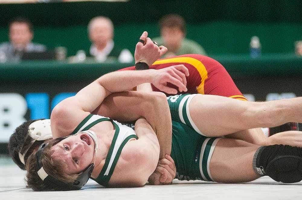 	<p>Junior 125-pounder Brenan Lyon and Iowa State&#8217;s Ryak Finch wrestle during a match Feb. 15, 2013, at Jenison Field House. Finch won 11-0. Julia Nagy/The State News</p>