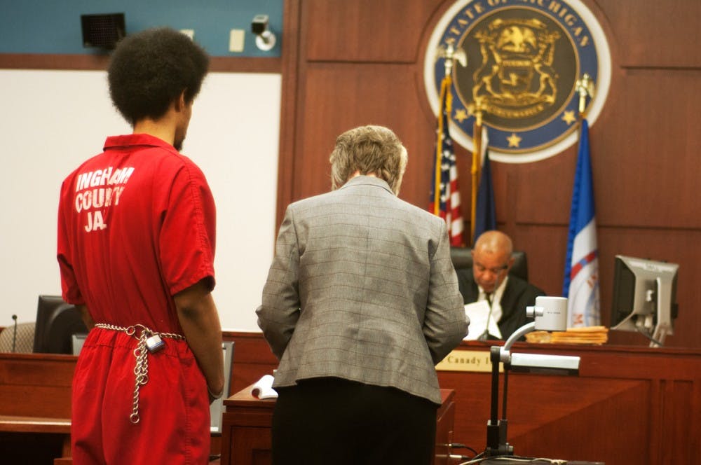 <p>Marquay McCoy, the 20-year-old convicted of murdering MSU student Dominique Nolff stands before the judge with his defense attorney Helen Nieuwenhuis April 8, 2015, at Veterans Memorial Courthouse, 313 W. Kalamazoo St. in Lansing. McCoy was sentenced 32 to 48 years in prison. Kelsey Feldpausch/The State News </p>