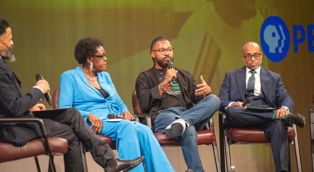 <p>Prince-Jerold Solace, Director of Congregational Life and Community Outreach at Lansing First Presbyterian Church, speaks on the panel after the showing of <em>The Cost of Inheritance</em> hosted by WKAR at the WKAR Studios on Jan. 18, 2024. </p>