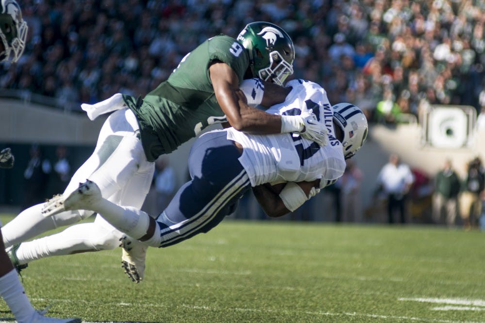 Junior safety Montae Nicholson (9) tackles Brigham Young running back Jamaal Williams (21) during the game against Brigham Young University on Oct. 8,  2016 at Spartan Stadium. 