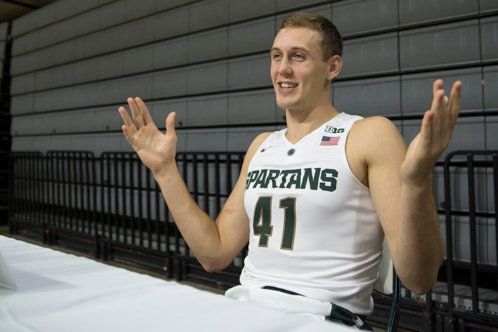 <p>Senior forward Colby Wollenman speaks to media during men's basketball media day on Oct. 27, 2015 at Breslin Center.</p>