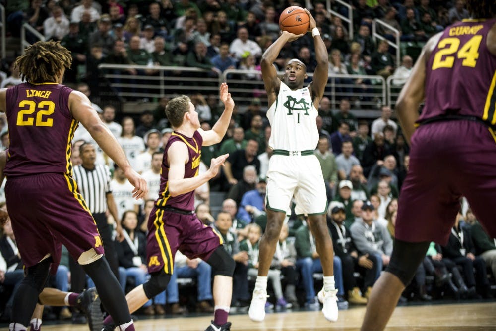 Freshman guard Joshua Langford shoots the ball during the first half of the men's basketball game against Minnesota on Jan. 11, 2017 at Breslin Center.
