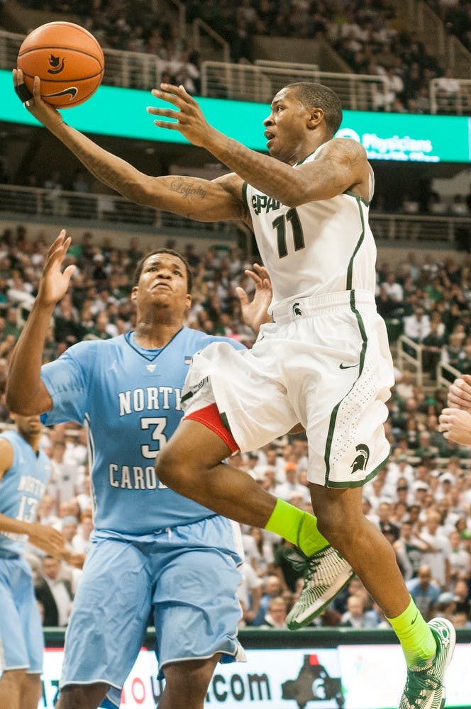 	<p>Senior guard Keith Appling goes for a lay-up during the game against North Carolina on Dec. 4, 2013, at Breslin Center. The Spartans were defeated by the Tar Heels, 79-65. Khoa Nguyen/The State News</p>