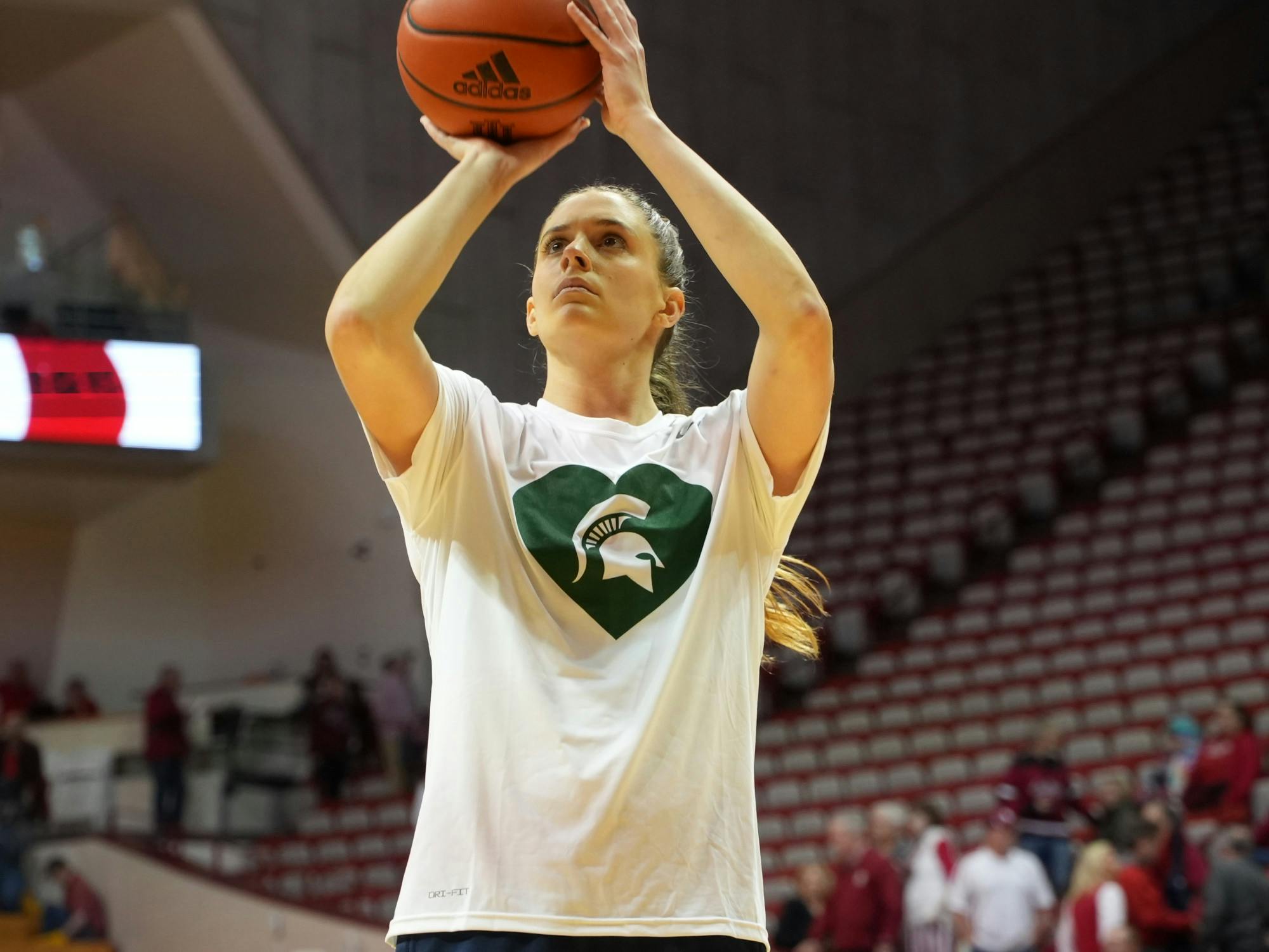 <p>University of Michigan graduate forward Emily Kiser dawns the team's specialty warm-ups, showing support for Michigan State after the mass shooting on the University's campus on Monday, Feb. 13, 2023. Courtesy of University of Michigan Athletics.</p>
