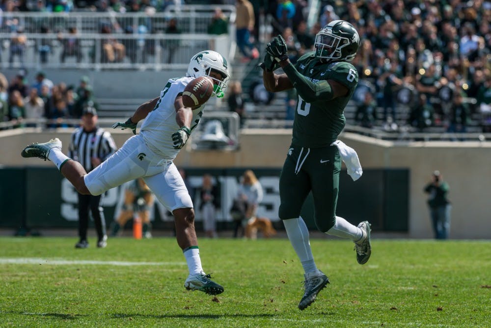 Senior safety David Dowell (6) breaks up a pass. The green team beat the white team, 42-26, in the MSU Spring football game at Spartan Stadium on April 13, 2019. 