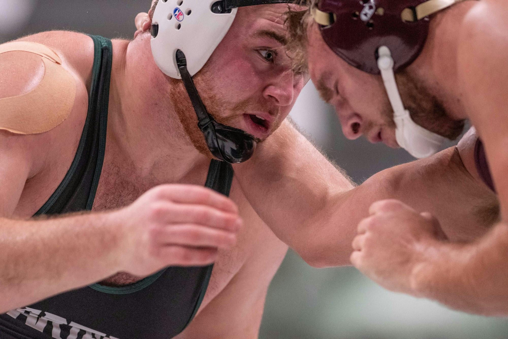 Redshirt junior Christian Rebottaro faces off with an opponent during the meet against Minnesota Jan. 17, 2020 at Jenison Fieldhouse. The Spartans fell to the Golden Gophers, 25-10.