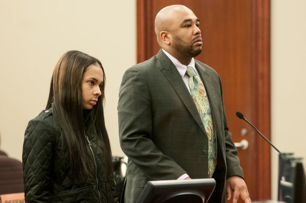 Detroit resident Brittani Barber-Gribble, left, and her attorney Kareem Johnson listen to the judge on Feb. 16, 2016 at the Ingham County Probate Court in Lansing. Barber-Gribble is the last of five women to plead guilty to  their individual roles in the assault against Ryah Kelly in Spartan Village last March. 