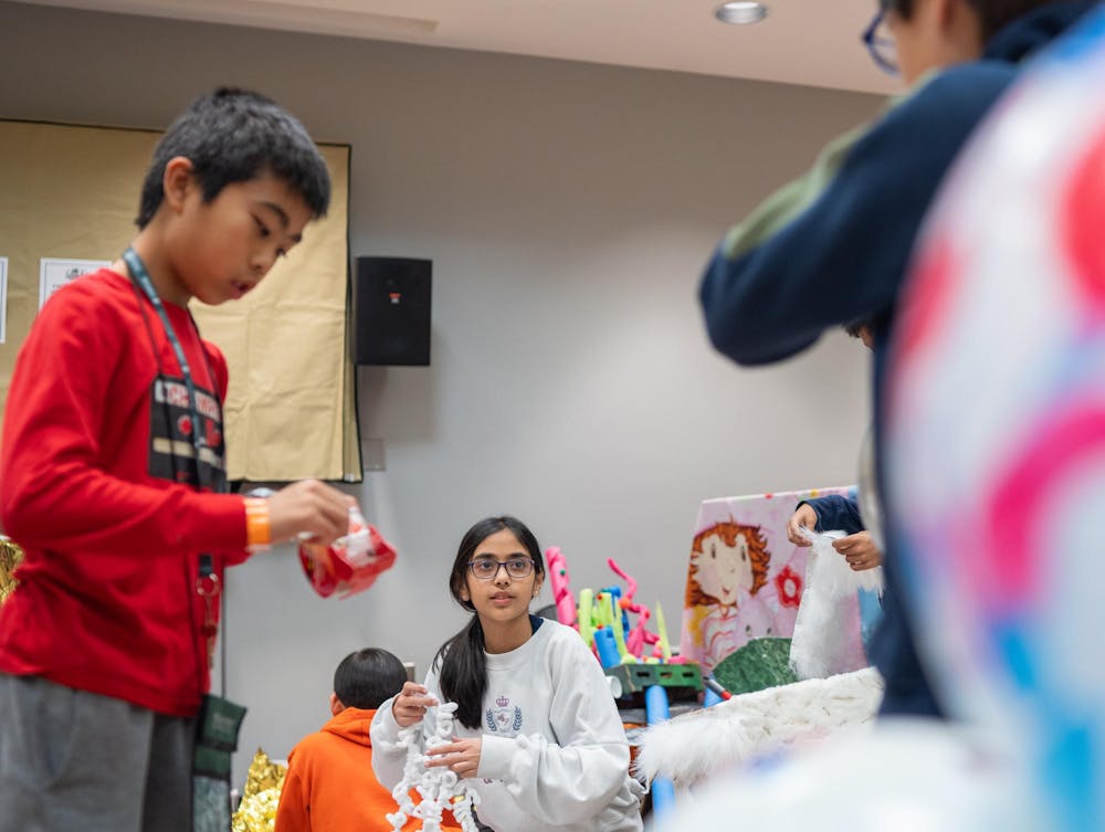 Odyssey of the Minds competitors prepare their OM-Mazing Race vehicle for competition in the Jack Breslin Center in East Lansing, Michigan on May 22, 2025. 
