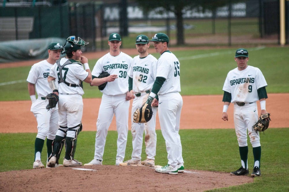 The Spartans gather at McLane Baseball Stadium on April 13, 2018. The Spartans fell to the Crusaders, 7-6. (Annie Barker | State News)