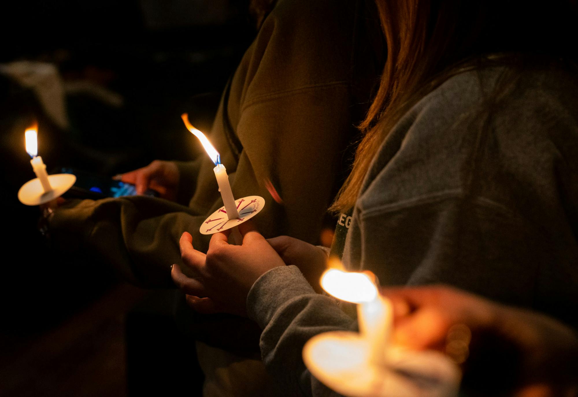 Chicago residents light candles during a vigil organized by Chicago Spartans to support the MSU Community on Feb. 18, 2023. Hundreds gathered at the Tree House in the city to mourn the loss of three fellow Spartans after a mass shooting took place on campus on Feb. 13, 2023. 