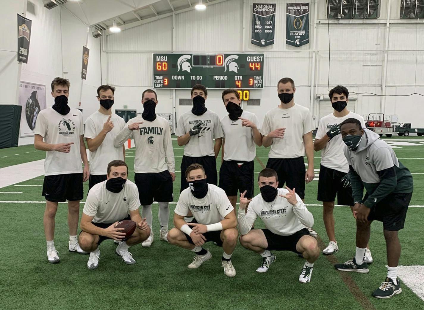 <p>Michigan State&#x27;s student equipment managers pose at the Skandalaris Football Center on the indoor practice field. </p><p></p><p>Pictured, back row (from left to right): Andrew Campbell, Michael Grodi, Dan Kalchik, Liam Ryan, Ben Connelly, Ryan Campbell, Nick Franz and Markael Butler. Front row (from left to right): Ryan Daugherty, Mason Ruddy and Casey Edwards. (Photo courtesy: Ryan Daugherty, Michigan State Class of 2022)</p>