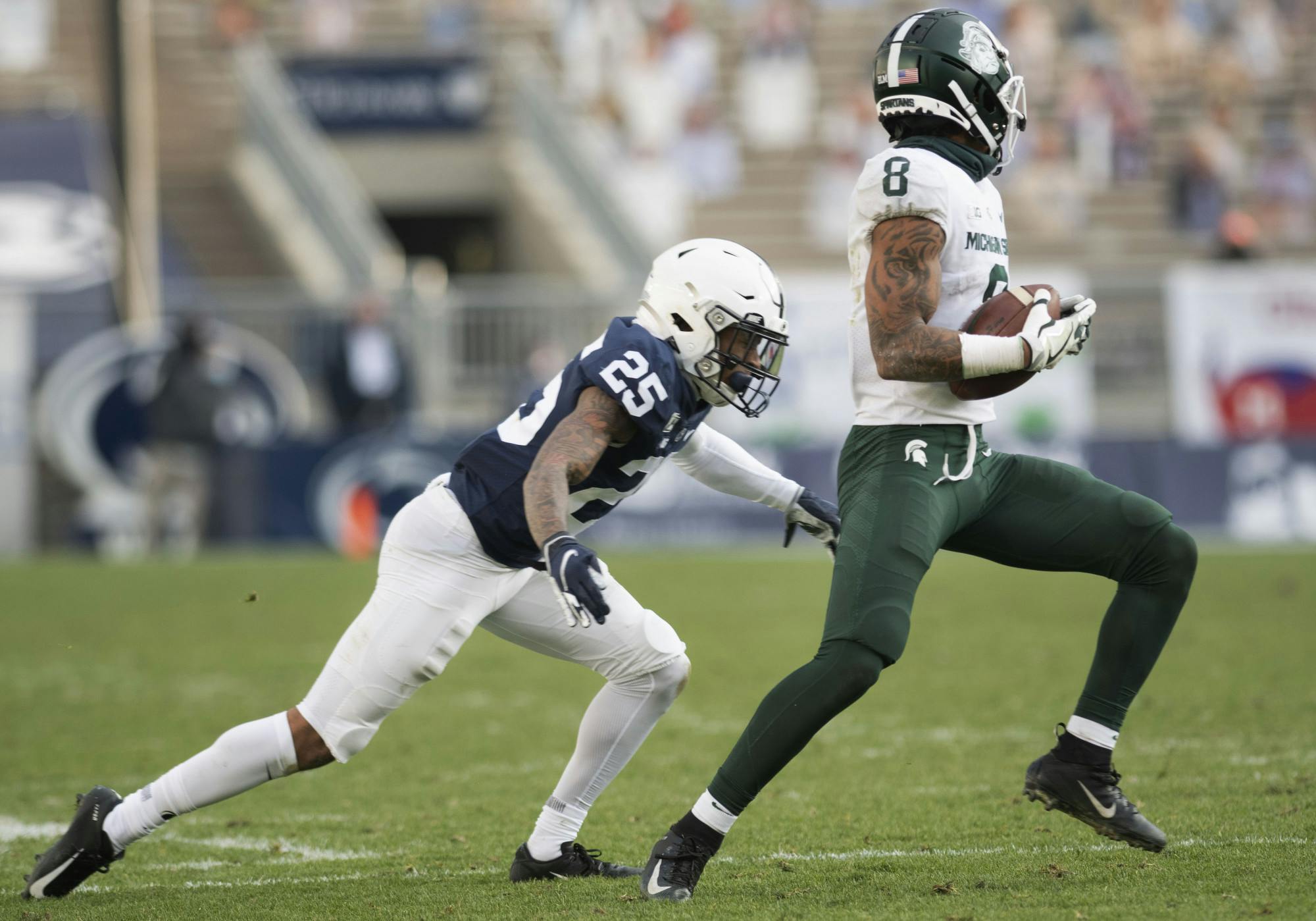 <p>Penn State cornerback Daequan Hardy (25) runs to tackle Michigan State’s Jalen Nailor (8) during the game on Saturday, Dec. 12, 2020, in Beaver Stadium. Penn State won 39-24. Photos courtesy of Lily LaRegina, photographer and photo editor at The Daily Collegian.</p>