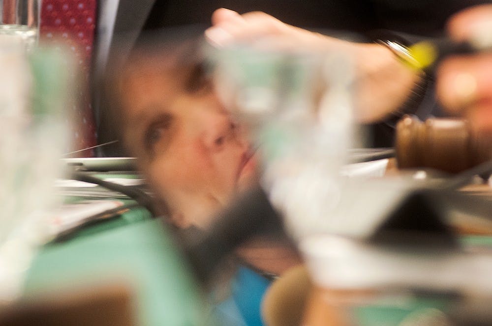 	<p>East Lansing Mayor Diane Goddeeris is reflected in East Lansing City Manager George Lahanas&#8217; iPad on June 25, 2013, during a special meeting at the Hannah Community Center to interview <span class="caps">DTN</span> Management Co. and Lurvey White Ventures, the two developers in contention for the Park District. The meeting was held before council&#8217;s regular meeting. Julia Nagy/The State News</p>