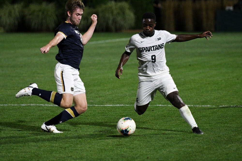 <p>Sophomore forward Farai Mutatu (9) steals the ball during the game at DeMartin Field on Sept. 24, 2019. The Spartans lost to the Fighting Irish 0-1. </p>