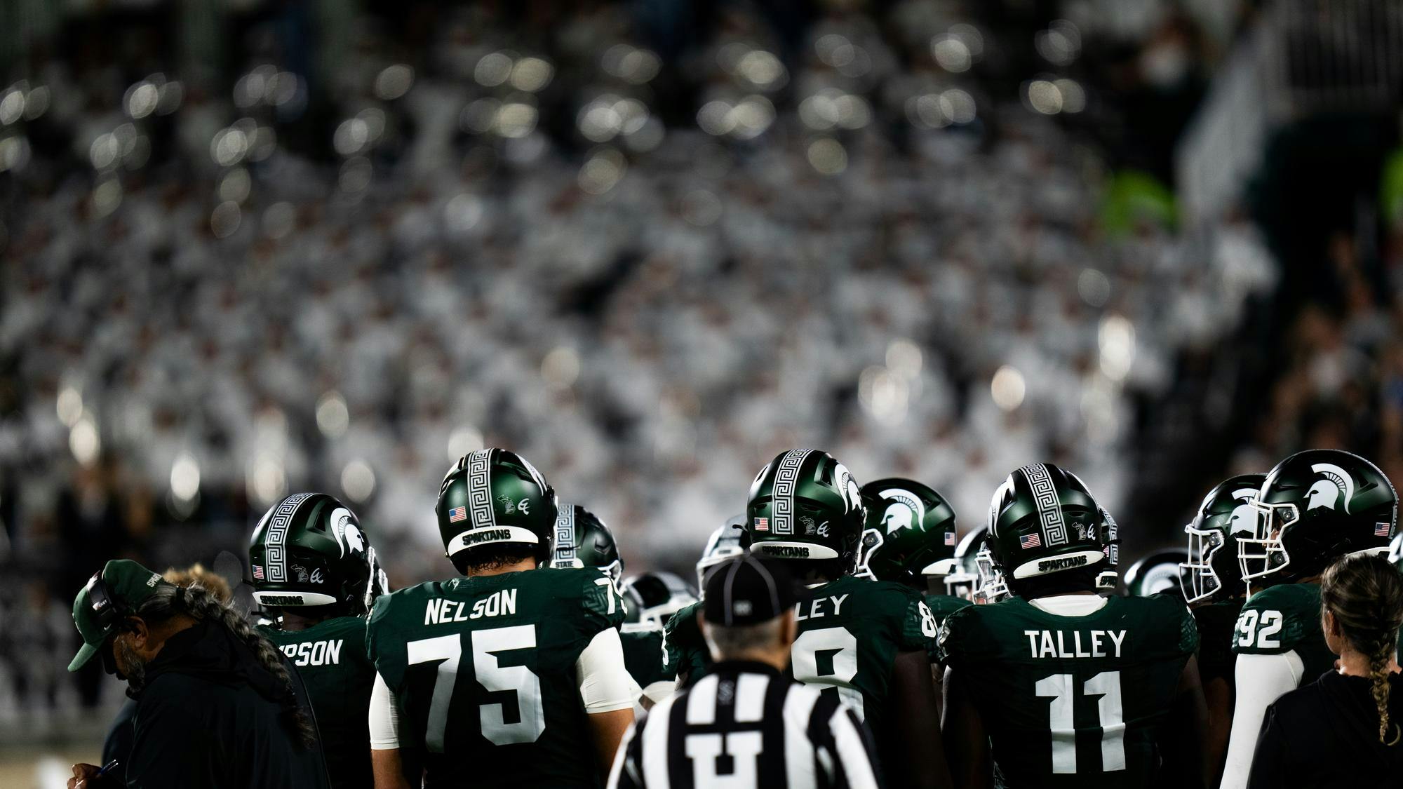 <p>The Michigan State Spartans take a team huddle during a stoppage in play of the game against the Ohio State Buckeyes at Spartan Stadium on Sept. 28, 2024. Despite a competitive first half, the Spartans fell 38-7 to the Buckeyes.</p>