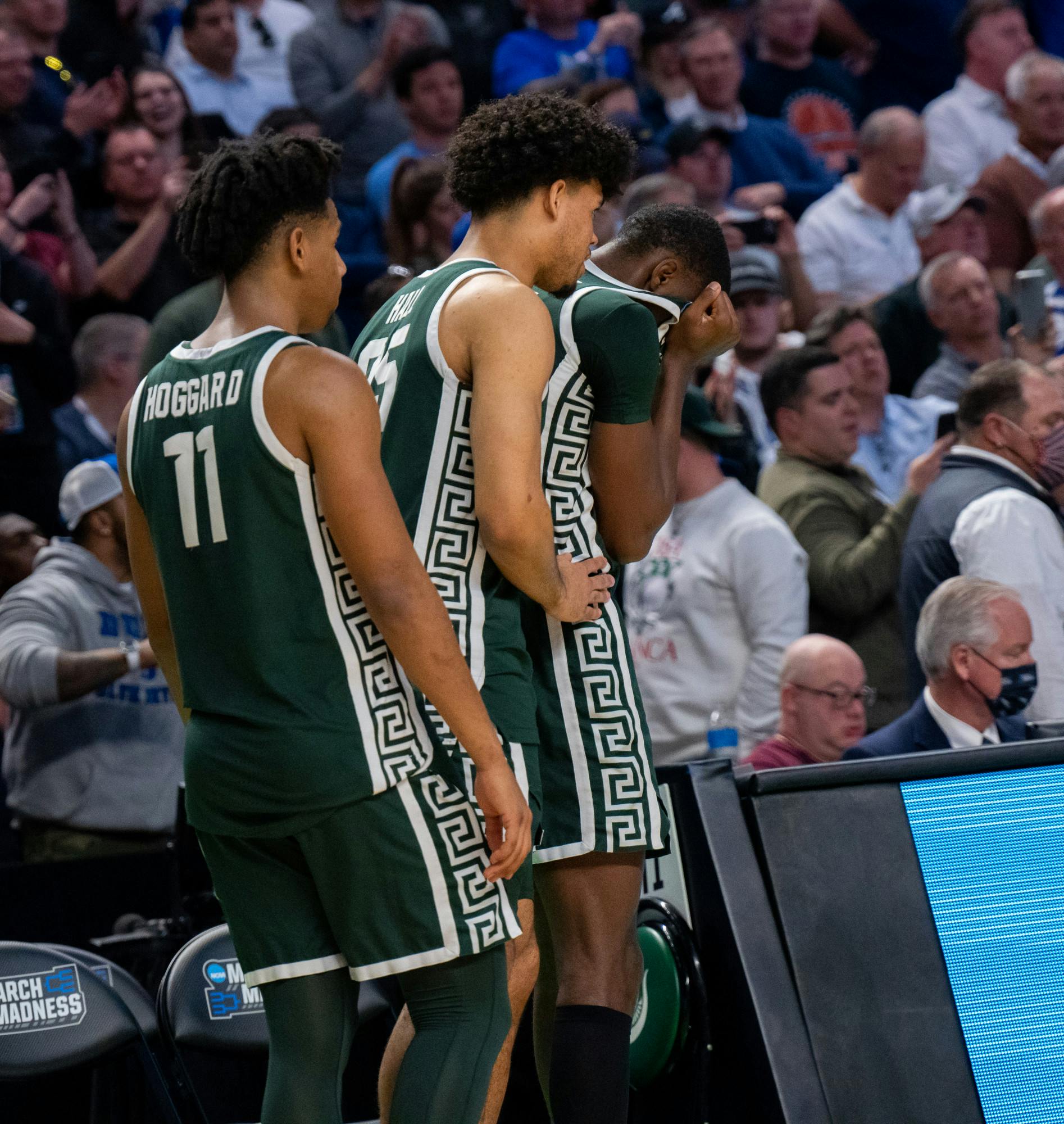 <p>Junior forward Malik Hall (25) comforts senior forward Gabe Brown (44) after Duke&#x27;s victory over Michigan State on March 20, 2022.</p>