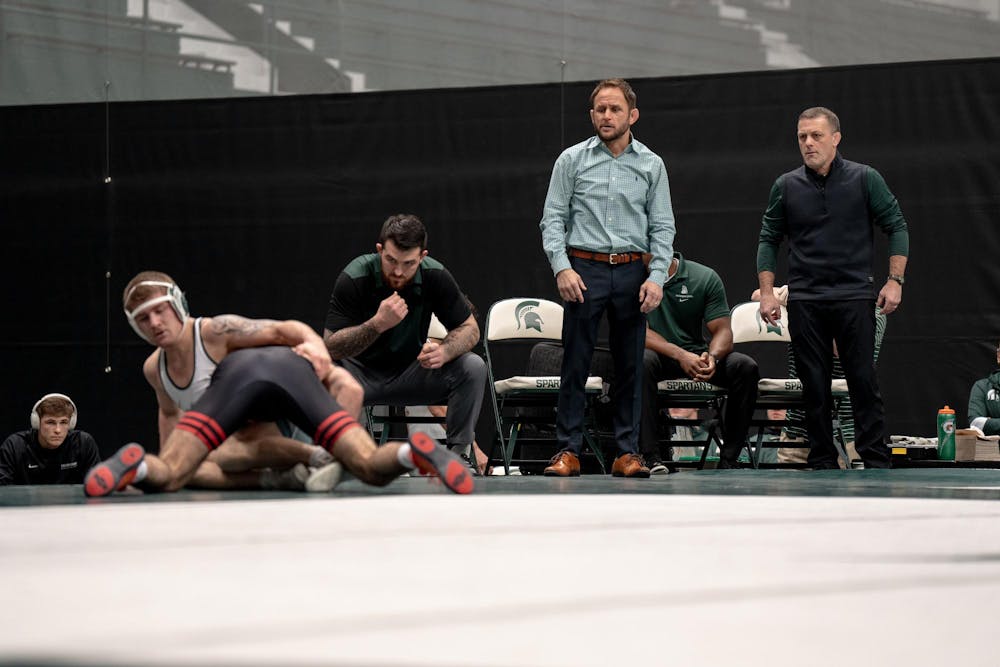 <p>Michigan State coaching staff watch as Michigan State No. 149 redshirt freshman Braden Stauffenberg (5-10) faces No. 45 junior Michael Cetta (9-5) of Rutgers. Michigan State fell to No. 12 Rutgers 22-13, falling to 0-2 in conference play.</p>