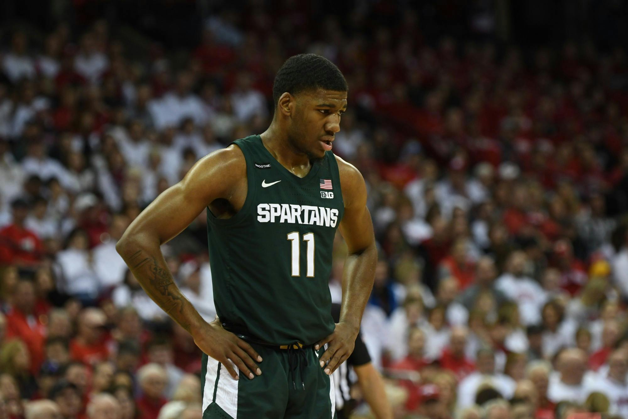 <p>Then-sophomore forward Aaron Henry (11) during the basketball game against Wisconsin at the Kohl Center in Madison on Feb. 1, 2020. The Spartans fell to the Badgers 63-64. </p>