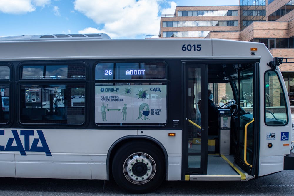 A CATA bus pulls into a stop in East Lansing on Sept. 18, 2020. The transportation service has new signage and is taking precautions to keep people safe.