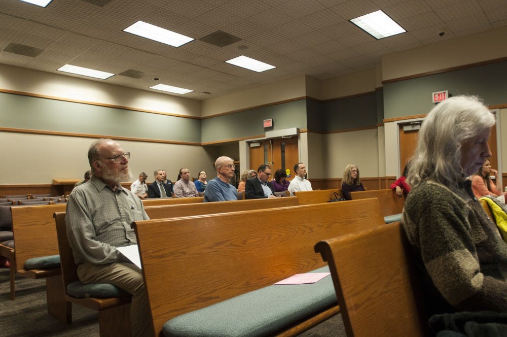 Members of the audience listen intently during the City of East Lansing budget meeting on Feb. 20, 2018 at 54B District Court. (C.J. Weiss | The State News)