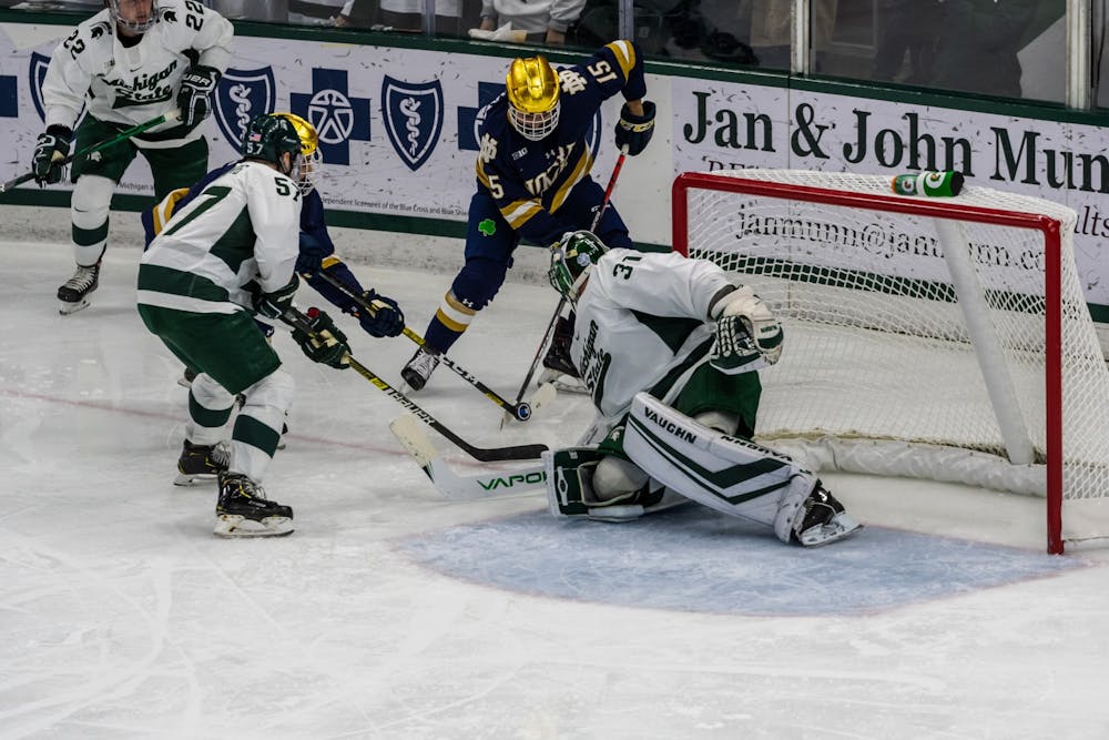 <p>Senior goalkeeper John Lethemon (31) defends against a Notre Dame shot. The Spartans were defeated by the Fighting Irish, 2-1, at Munn Ice Arena on November 22, 2019. </p>