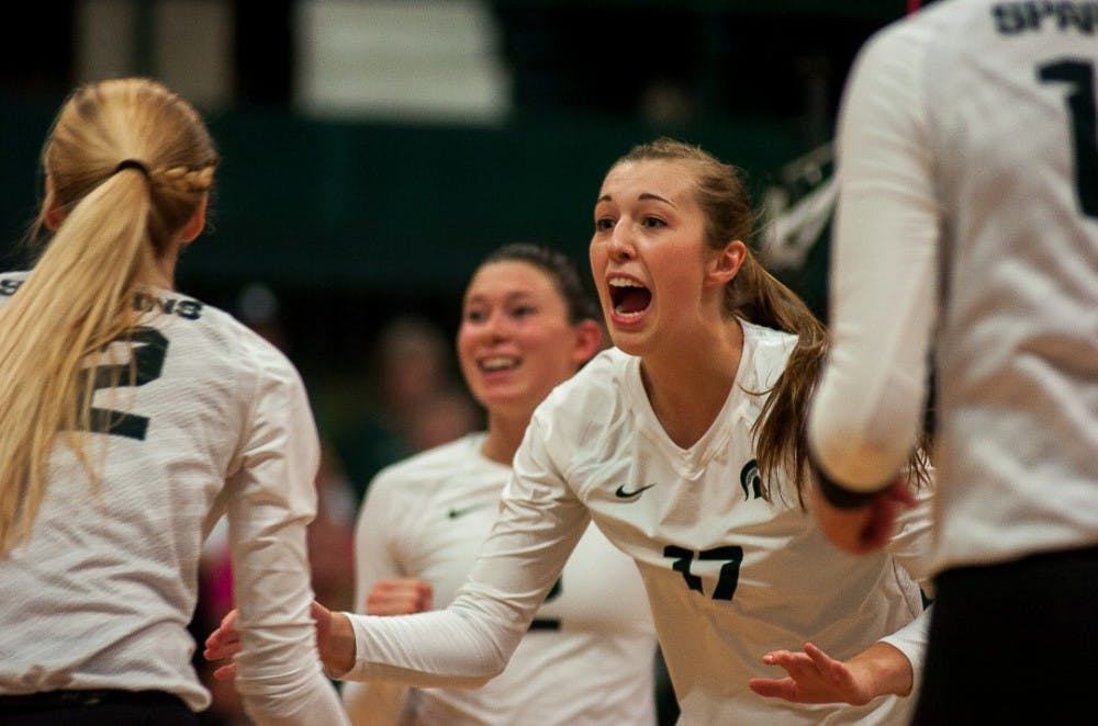 <p>&nbsp;Senior middle blocker Alyssa Garvelink (17) reacts to a play during the game against Wisconsin on Oct. 7, 2017 at Jenison Fieldhouse. The Spartans defeated the Badgers, 3-1. &nbsp;&nbsp;</p>