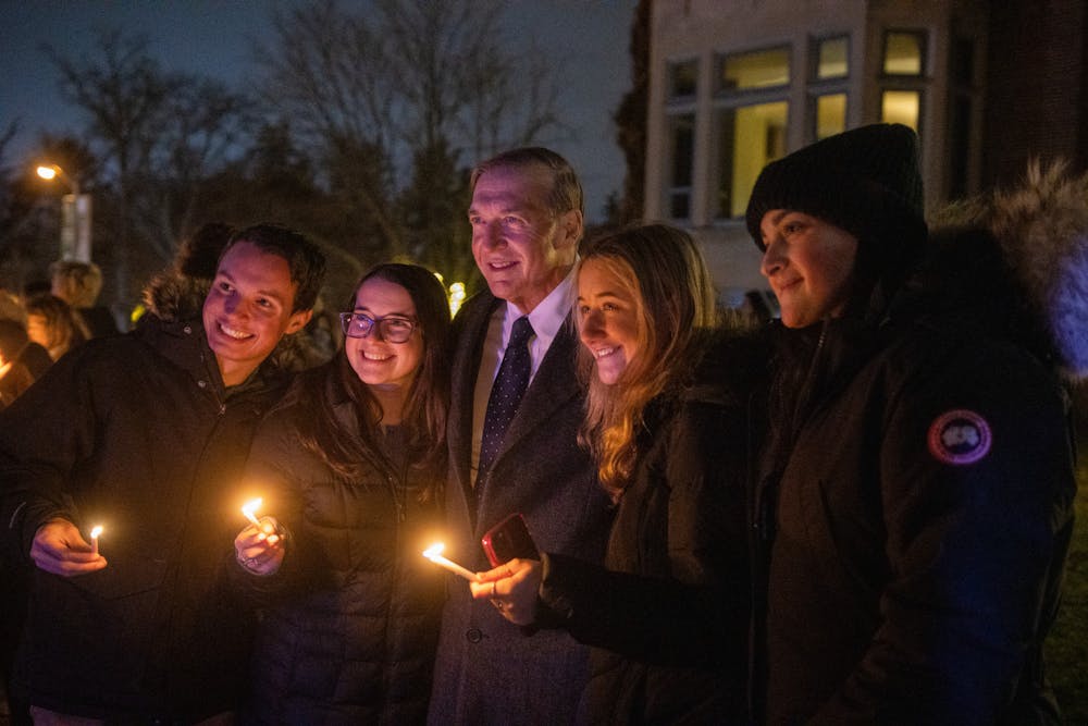 <p>MSU President Samuel L. Stanley Jr. joins students to celebrate Hanukkah with the lighting of the Menorah at the Union on Dec. 1, 2021.</p>