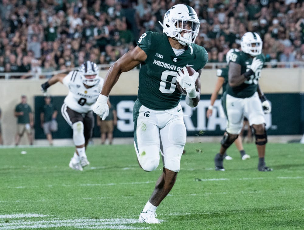 <p>MSU redshirt sophomore running back Jalen Berger (8) makes his way down the field during season opener at Spartan Stadium on Sept. 2, 2022. The Spartans beat the Broncos with a score of 35-13.&nbsp;</p>