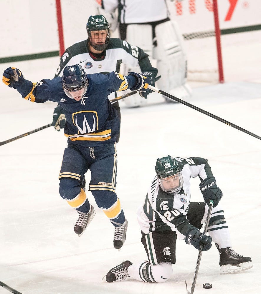 	<p>Freshman forward Mike Ferrantino hits the puck up the ice on Oct. 8 at Munn Ice Arena. <span class="caps">MSU</span> defeated Windsor, 6-1, in the first and only exhibition game. Adam Toolin/The State News</p>