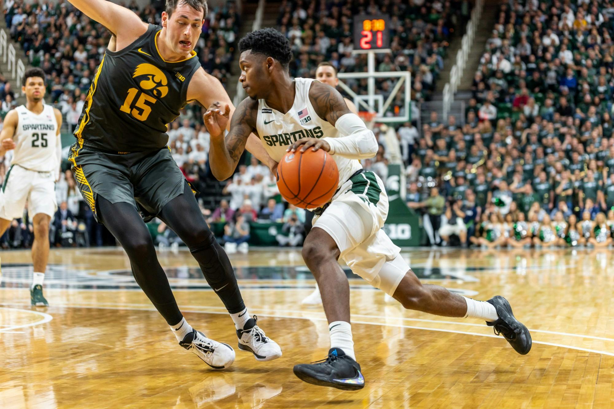 <p>Sophomore guard Rocket Watts (right) drives on Iowa forward Ryan Kriener (left). The Spartans defeated the Hawkeyes, 78-70, at the Breslin Student Events Center on Feb. 25, 2020. </p>