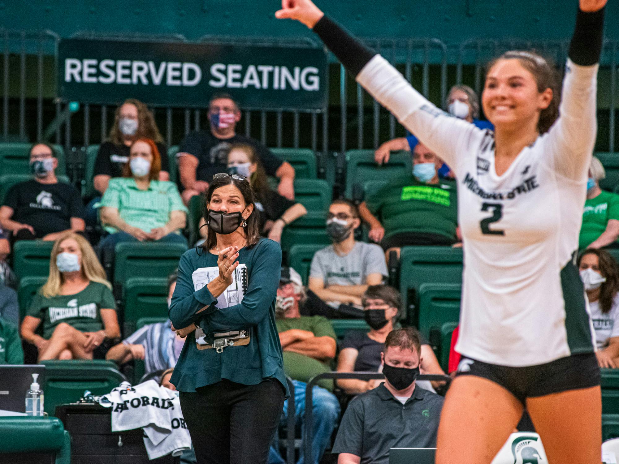 <p>Head coach Cathy George looks on as the Spartans score a point. The Spartans defeated the Grizzlies in three sets on Friday, Sept. 17.</p>