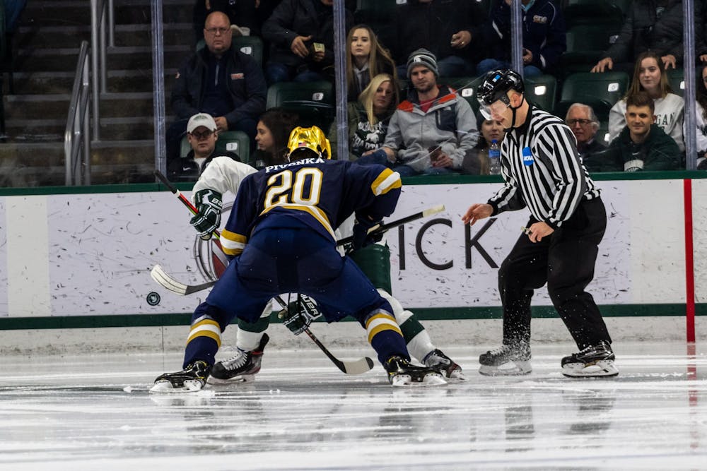 <p>Notre Dame center Jake Pivonka faces off with a Michigan State player. The Spartans were defeated by the Fighting Irish, 2-1, at Munn Ice Arena on November 22, 2019. </p>