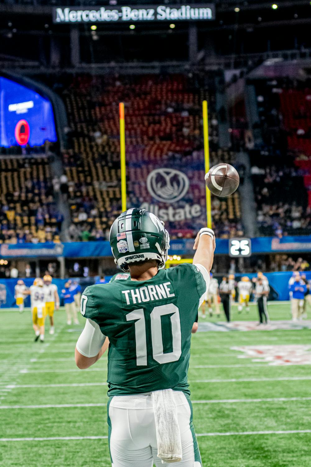 <p>Redshirt sophomore Payton Thorne throws passes before the Spartans 31-21 victory against Pitt in the Chick-Fil-A Peach Bowl on Dec. 30, 2021.</p>