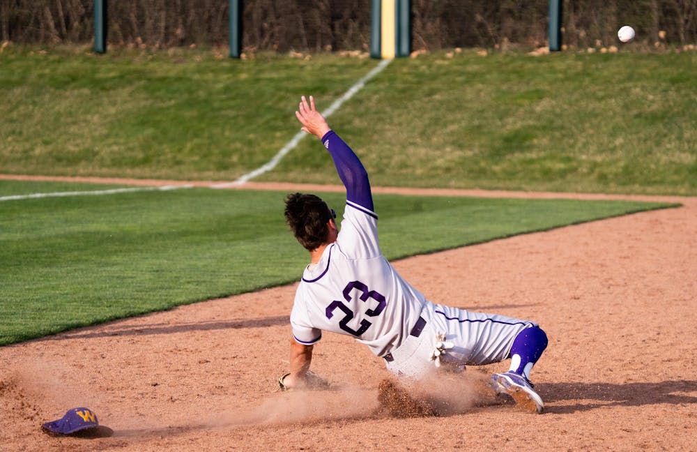 <p>WIU first baseman J.R. Heavilin slides while trying to catch a foul ball that went over the fence at McLane Baseball Stadium on Friday, April 14, 2023. J.R. Heavilin recorded one run on two hits in the Friday night matchup.</p>