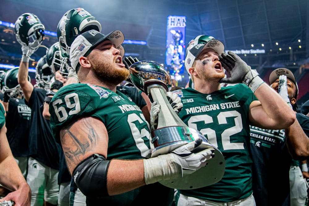 <p>Spartans sing the fight song after a 31-21 victory against Pitt in the Chick-Fil-A Peach Bowl on Dec. 30, 2021.</p>
