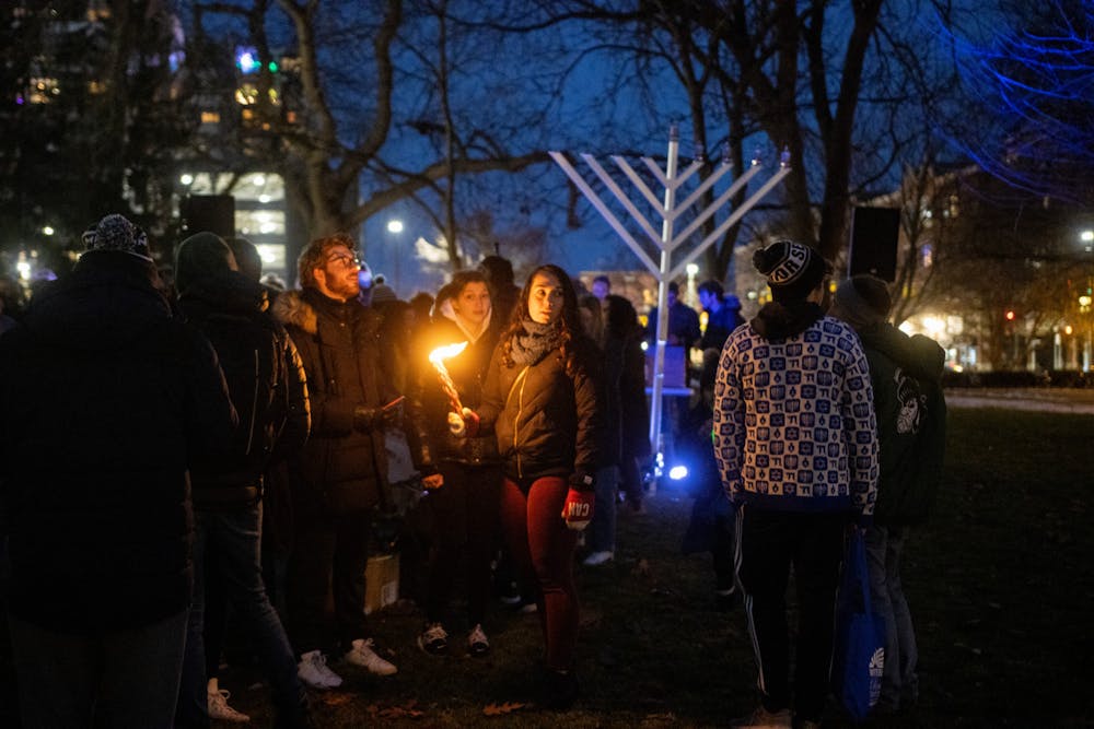 <p>MSU students celebrate Hanukkah with the lighting of the Menorah at the Union on Dec. 1, 2021.</p>