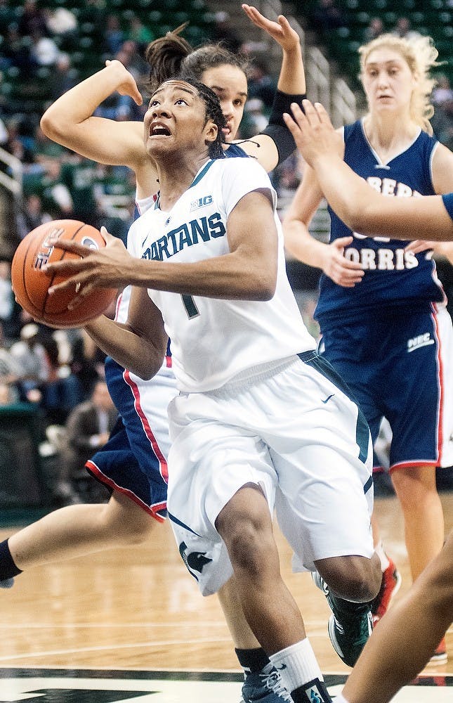 	<p>Senior guard Jasmine Thomas jumps for the net to score two points Nov. 25, 2012, at Breslin Center. Thomas recorded 14 points during a 68-35 victory over Robert Morris. Adam Toolin/The State News</p>