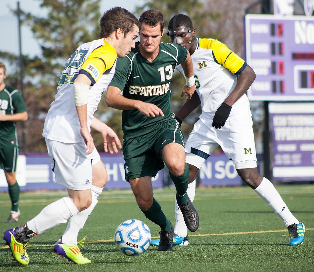 	<p>Sophomore forward Adam Montague runs past Michigan players during the Big Ten Tournament Championship game on Sunday, Nov. 11, 2012, at Lakeside Field at Northwestern in Evanston, Ill. The Spartans beat the Wolverines, 2-1, in overtime. Julia Nagy/The State News</p>