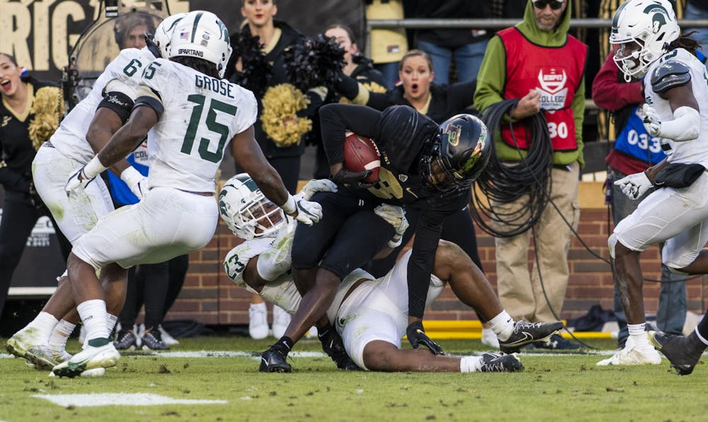 <p>Snow tackles Purdue&#x27;s David Bell (3) in the Spartan’s match against the Boilermakers at Ross-Ade Stadium in West Lafayette on Saturday, Nov. 6, 2021.</p>