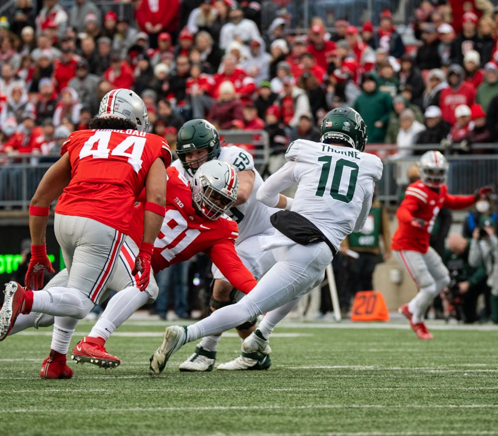 <p>Michigan State&#x27;s Payton Thorne (10) avoids getting tackled during Michigan State&#x27;s loss to Ohio State on Nov. 20, 2021.</p>