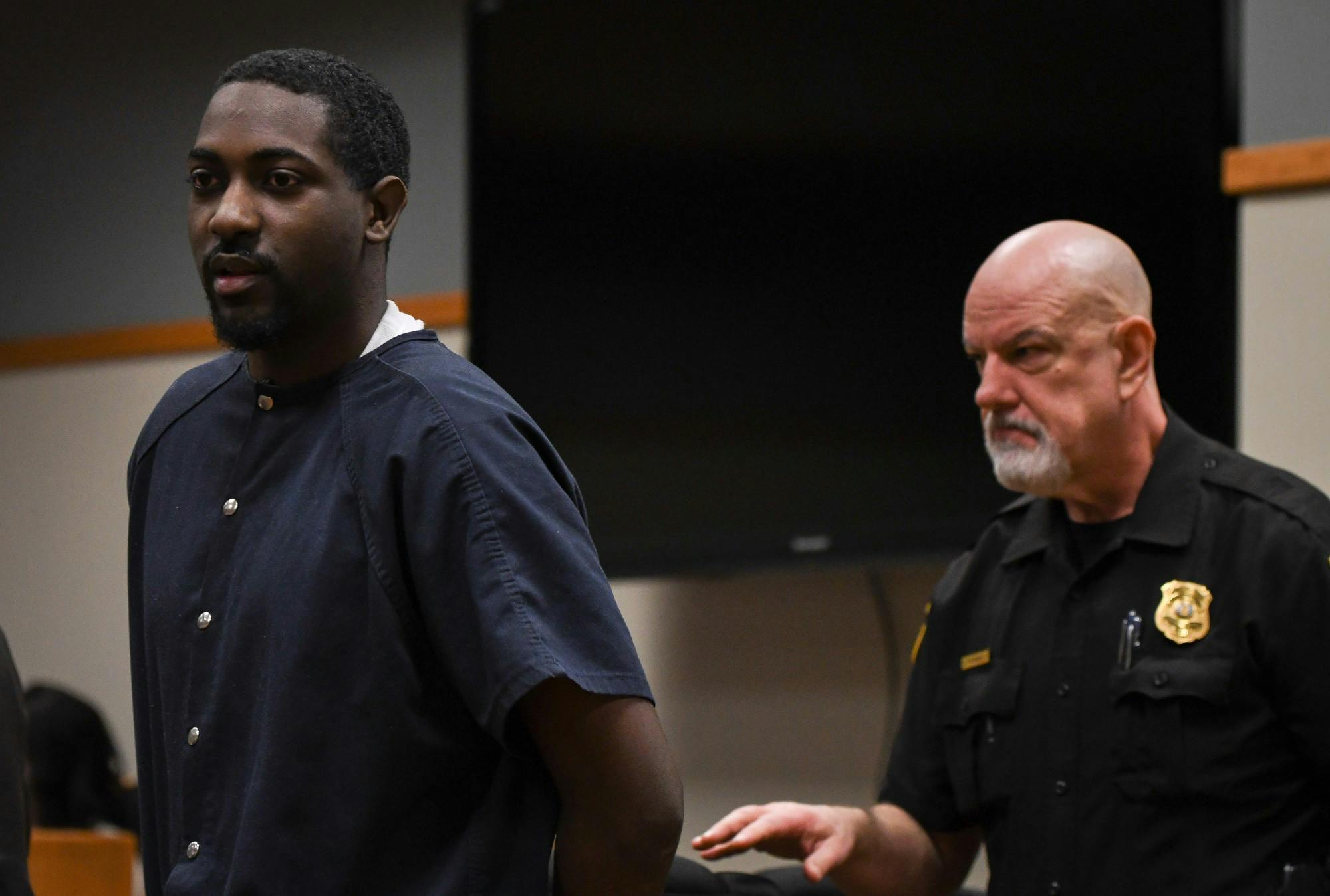<p>22-year-old Najee Thompson is escorted out of the courtroom following his preliminary hearing in the 54B District Court on Feb. 6, 2020. </p>