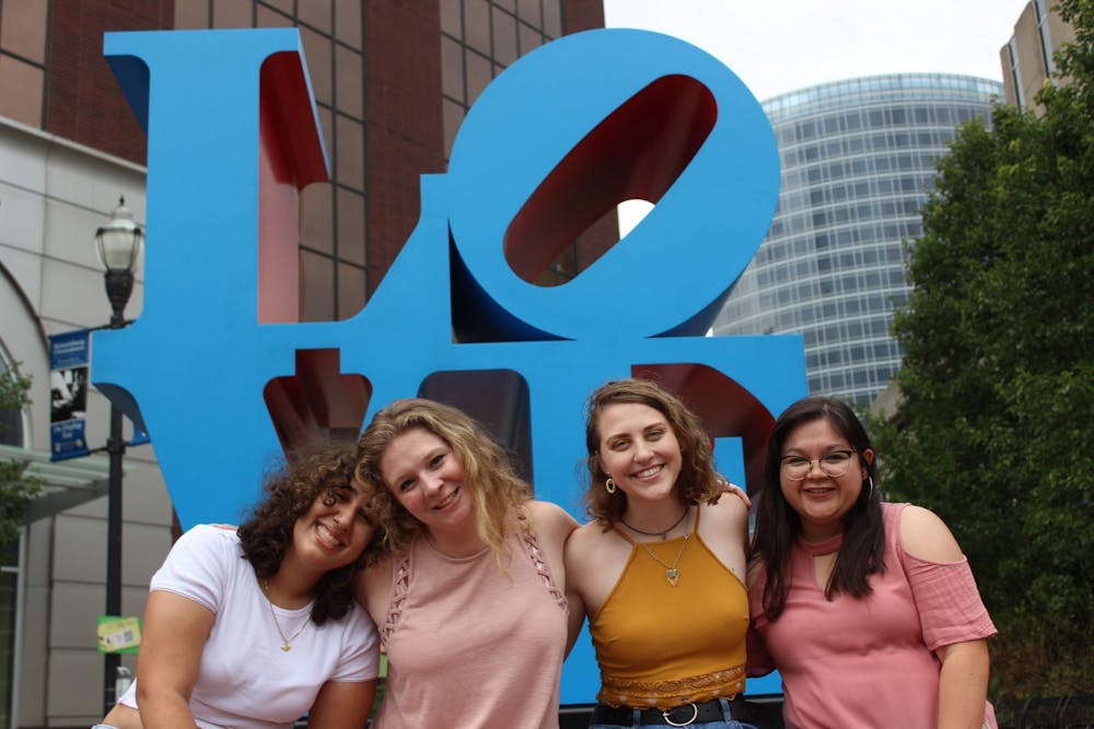 <p>Rosa Razmi, Alyson Walters, Karly Graham and Kathleen Fallon pose for a photo in front of a sculpture in Grand Rapids.</p>