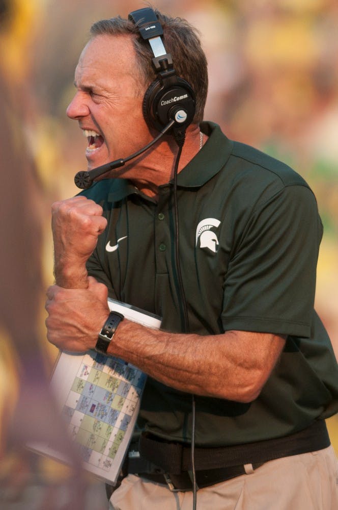 <p>Head coach Mark Dantonio reacts to a play in the third quarter during the game against Oregon on Sept. 6, 2014, at Autzen Stadium in Eugene, Ore. The Spartans lost to the Ducks, 46-27. Julia Nagy/The State News</p>