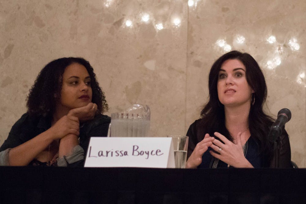 Executive Director of the Firecracker Foundation Tashmica Torok, left, listens to Nassar survivor Larissa Boyce on a panel about addressing red flags to identify sexual offenders at the MSU Union on Sept. 21, 2018.