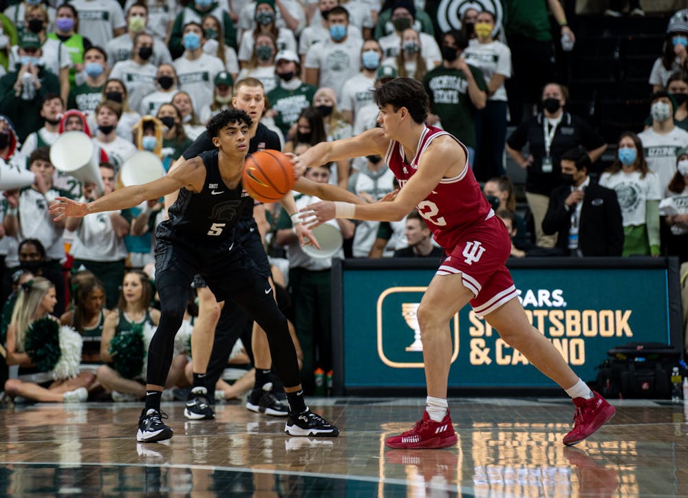 <p>Michigan State freshman Max Christie (5) guards Indiana&#x27;s sophomore guard Trey Galloway (32) during Michigan State&#x27;s victory over Indiana on Feb. 12, 2022.</p>